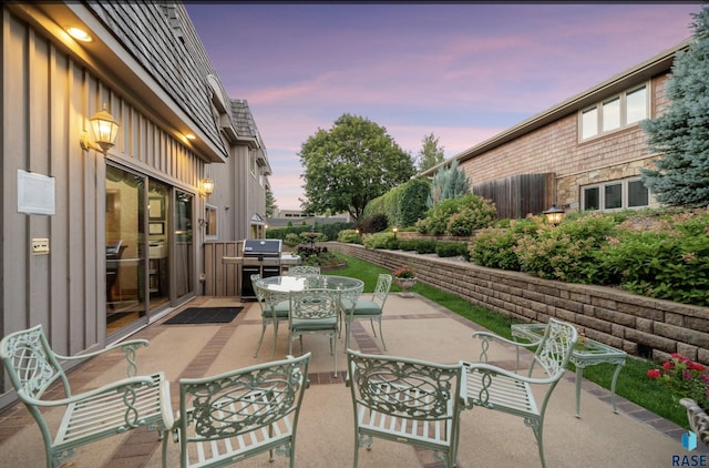 view of patio terrace at dusk