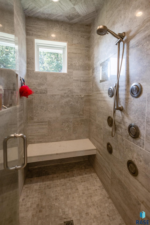 bathroom with tiled shower