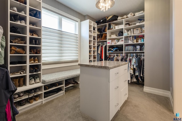 spacious closet featuring light carpet