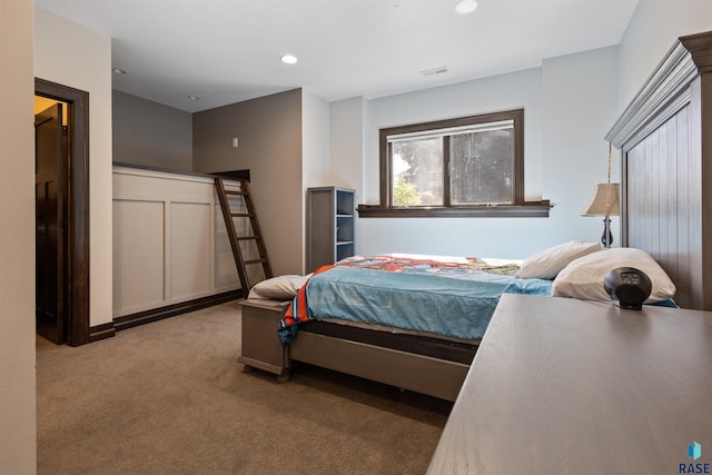 bedroom with light colored carpet
