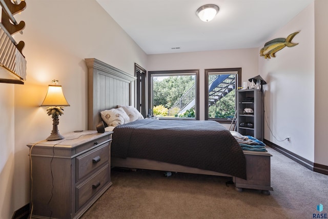 bedroom with dark carpet