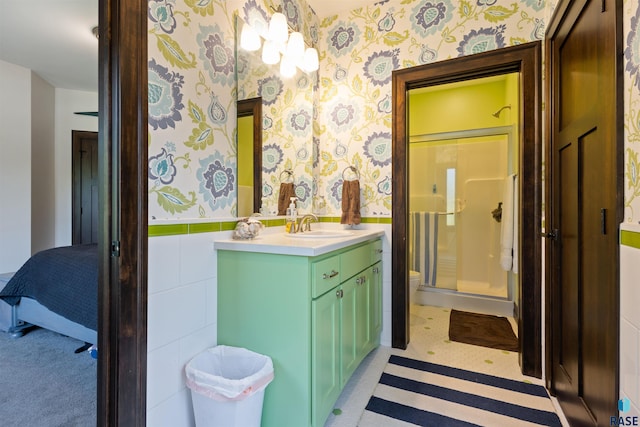 bathroom with toilet, vanity, and walk in shower