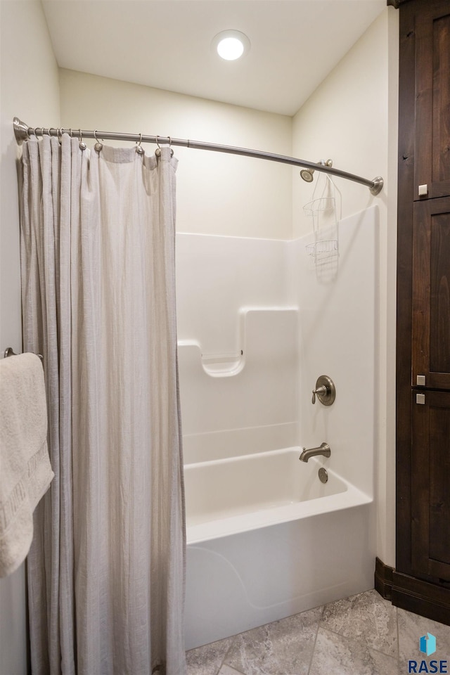 bathroom featuring shower / bath combo with shower curtain