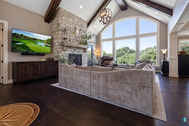 living room with dark hardwood / wood-style flooring, beam ceiling, high vaulted ceiling, an inviting chandelier, and a fireplace