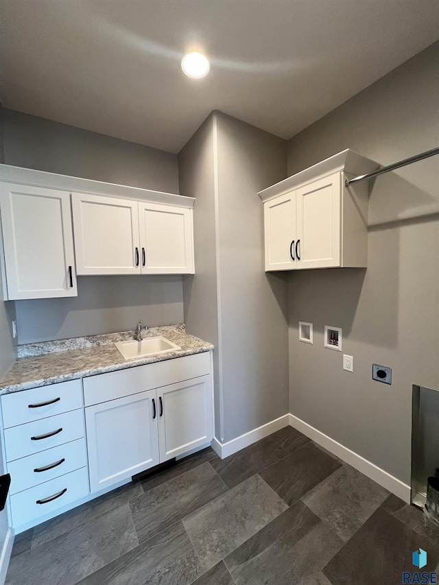 laundry area featuring cabinets, hookup for a washing machine, sink, and electric dryer hookup