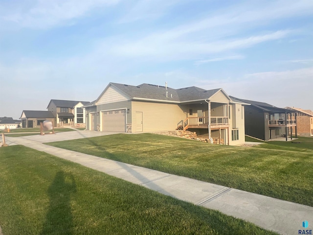 view of front of home with a garage and a front yard