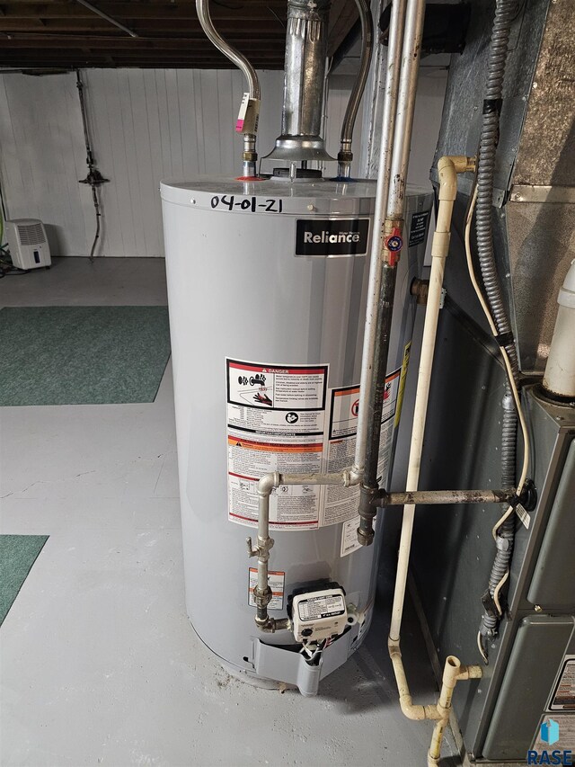 utility room with water heater