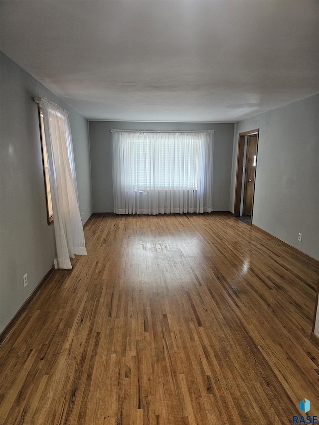 empty room featuring hardwood / wood-style flooring