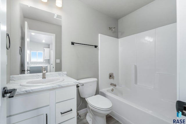 full bathroom featuring vanity, toilet, tub / shower combination, and wood-type flooring