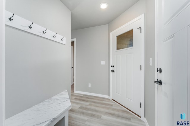 mudroom with light hardwood / wood-style flooring