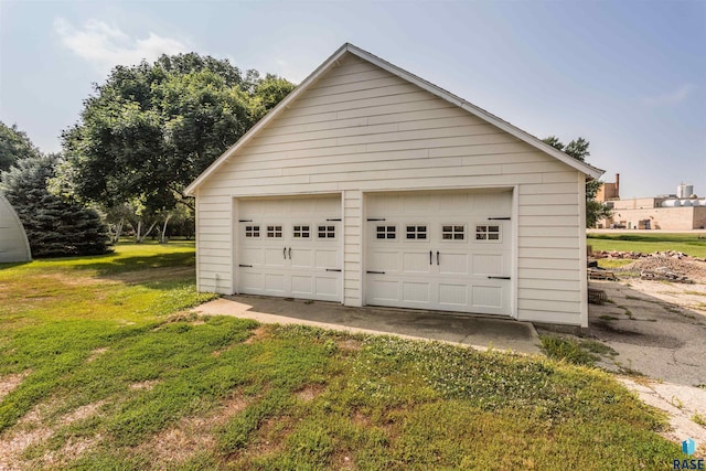 garage featuring a yard