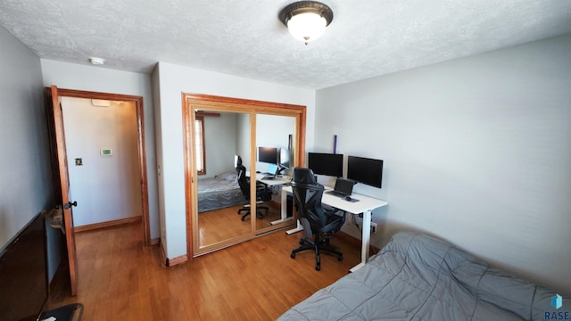 office space featuring hardwood / wood-style flooring and a textured ceiling