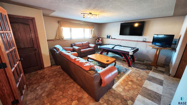 living room featuring a textured ceiling