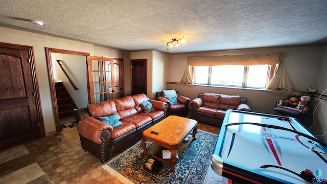 living room featuring a textured ceiling