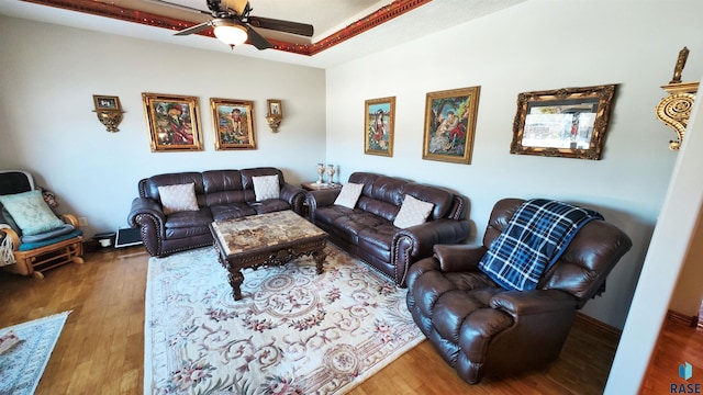 living room with hardwood / wood-style flooring and ceiling fan