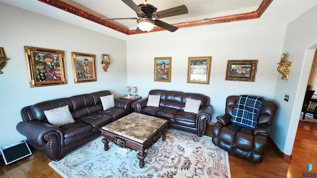 living room featuring dark hardwood / wood-style flooring and ceiling fan