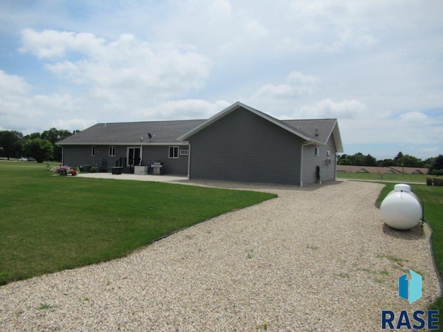 exterior space featuring a patio area and a yard