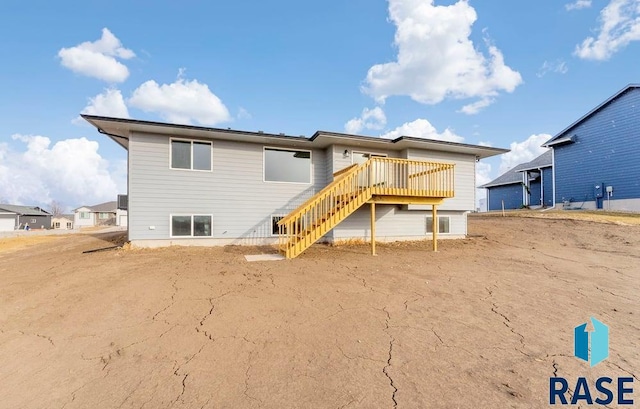 rear view of property with a deck