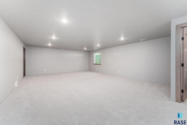 empty room featuring light colored carpet