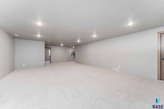 basement with light colored carpet