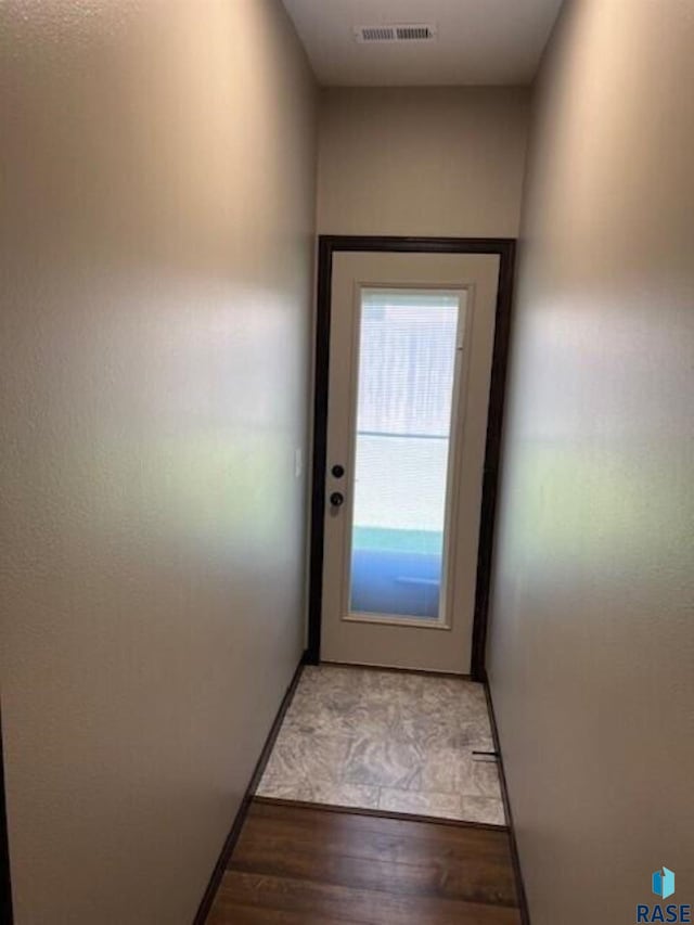 doorway with light hardwood / wood-style floors