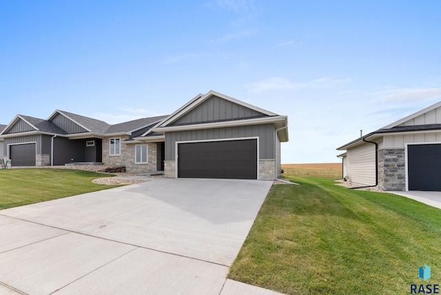 view of front of property featuring driveway, an attached garage, a front lawn, and board and batten siding