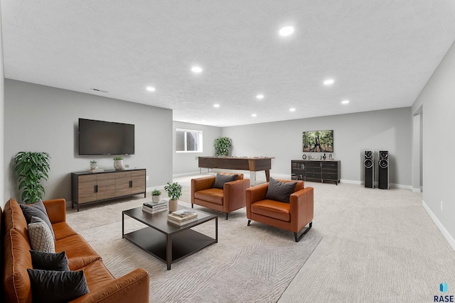 living area featuring visible vents, baseboards, light colored carpet, a textured ceiling, and recessed lighting