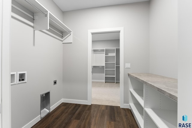 laundry area featuring washer hookup, dark wood-style flooring, hookup for an electric dryer, laundry area, and baseboards