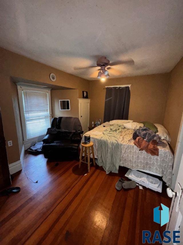 bedroom featuring hardwood / wood-style floors and ceiling fan