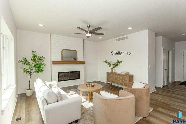 6513 S Barclay Trl, Sioux Falls, SD 57106 - living area with a ceiling fan, wood finished floors, a large fireplace, baseboards, and recessed lighting