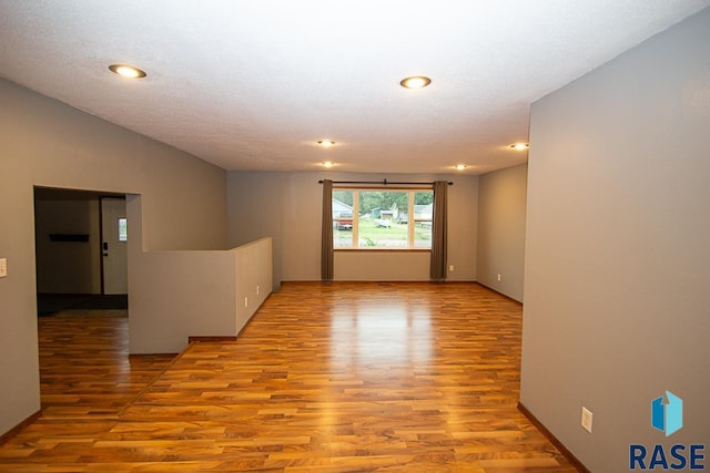 unfurnished room featuring recessed lighting and light wood finished floors