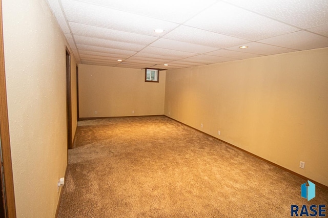 finished basement with carpet, baseboards, a drop ceiling, and recessed lighting