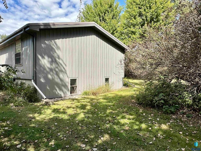 view of property exterior featuring a lawn