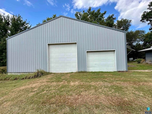 garage with a yard