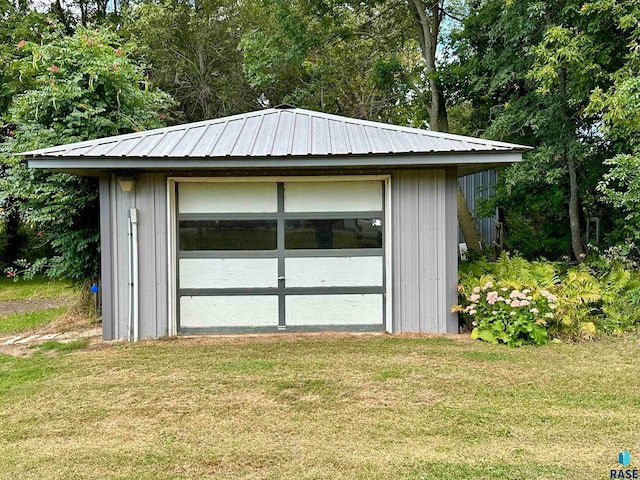 garage with a lawn