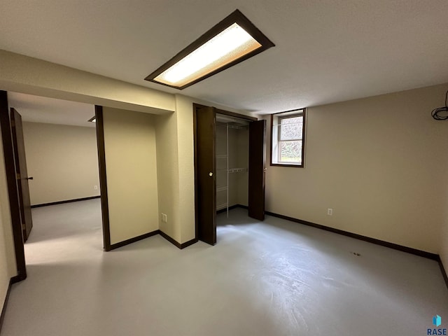 basement featuring a textured ceiling