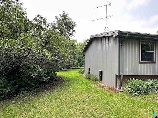 view of property exterior featuring a yard