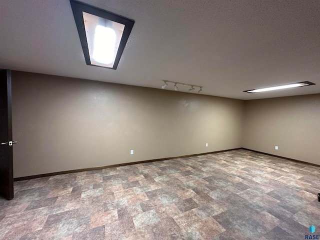 interior space featuring a textured ceiling