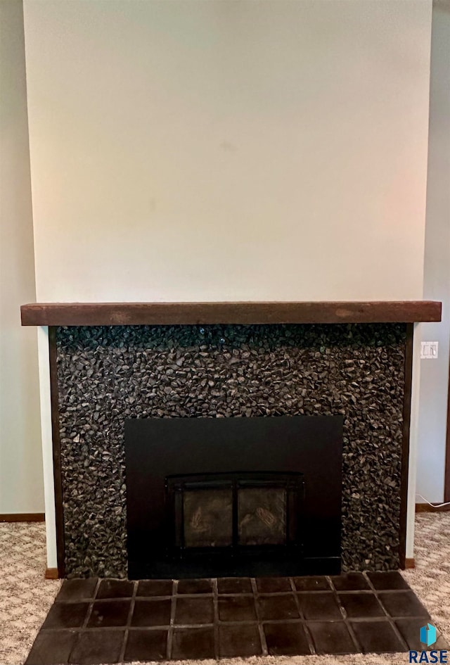 details featuring a tile fireplace