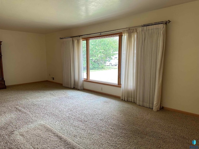 empty room featuring light colored carpet