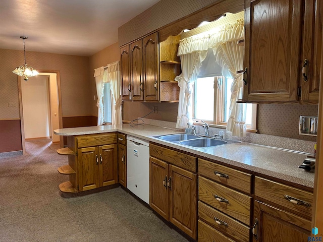 kitchen featuring dark colored carpet, white dishwasher, sink, kitchen peninsula, and an inviting chandelier