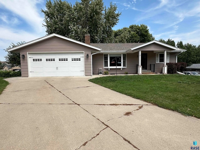 ranch-style house with a garage and a front yard