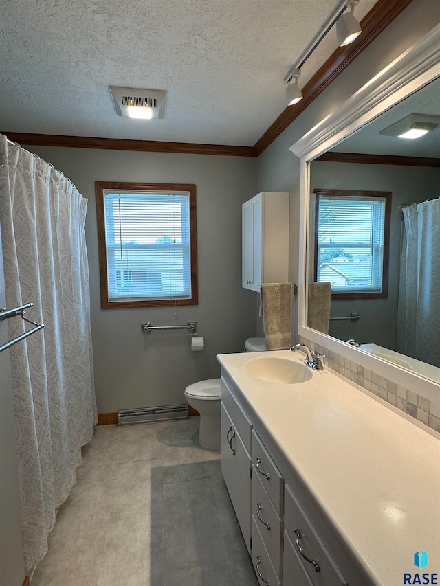 bathroom featuring rail lighting, toilet, a textured ceiling, and vanity