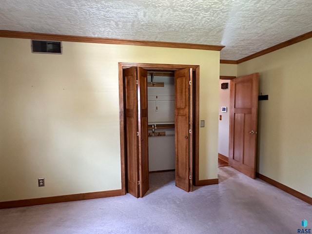 unfurnished bedroom featuring a closet and a textured ceiling