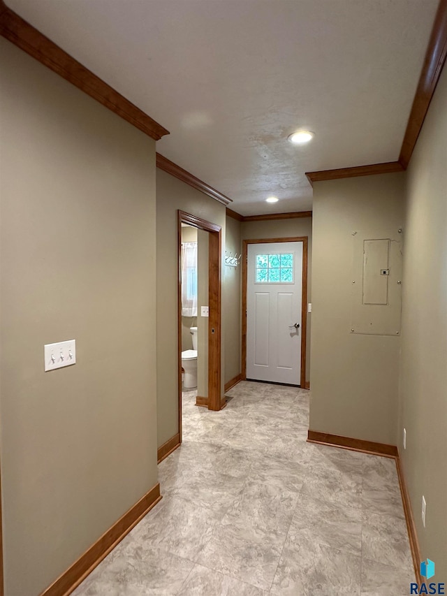 hall featuring light tile patterned flooring, crown molding, and electric panel