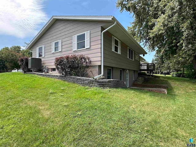 rear view of property with a lawn