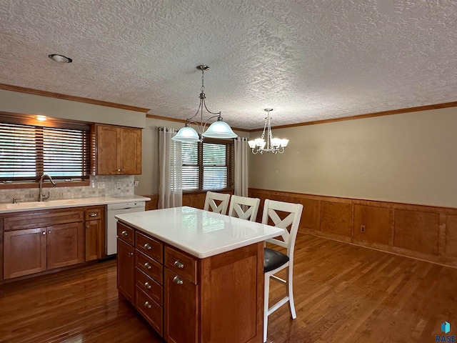 kitchen featuring sink, plenty of natural light, dishwasher, and dark hardwood / wood-style floors