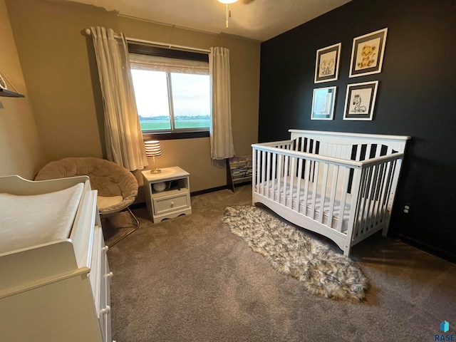 carpeted bedroom with a crib