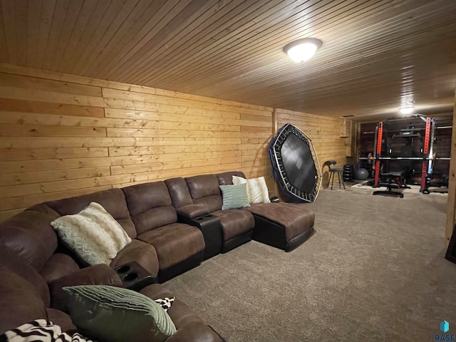 living room featuring carpet flooring, wood walls, and wood ceiling