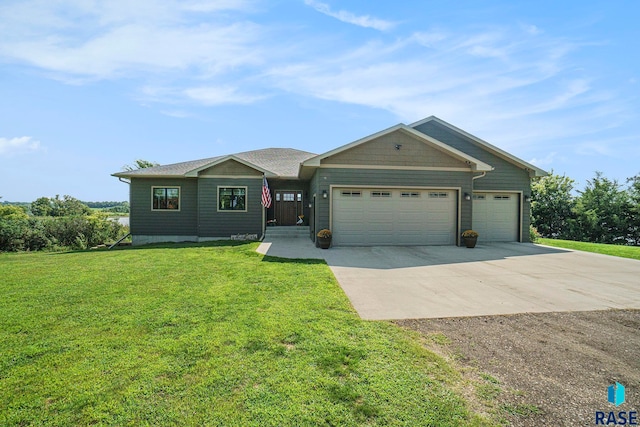 ranch-style house featuring a garage and a front yard